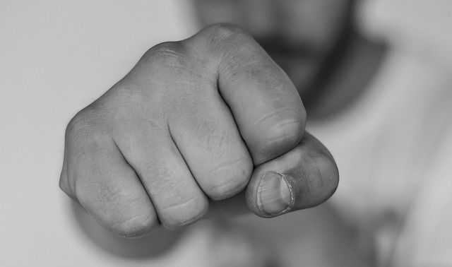 A black and white photo of a man's fist.