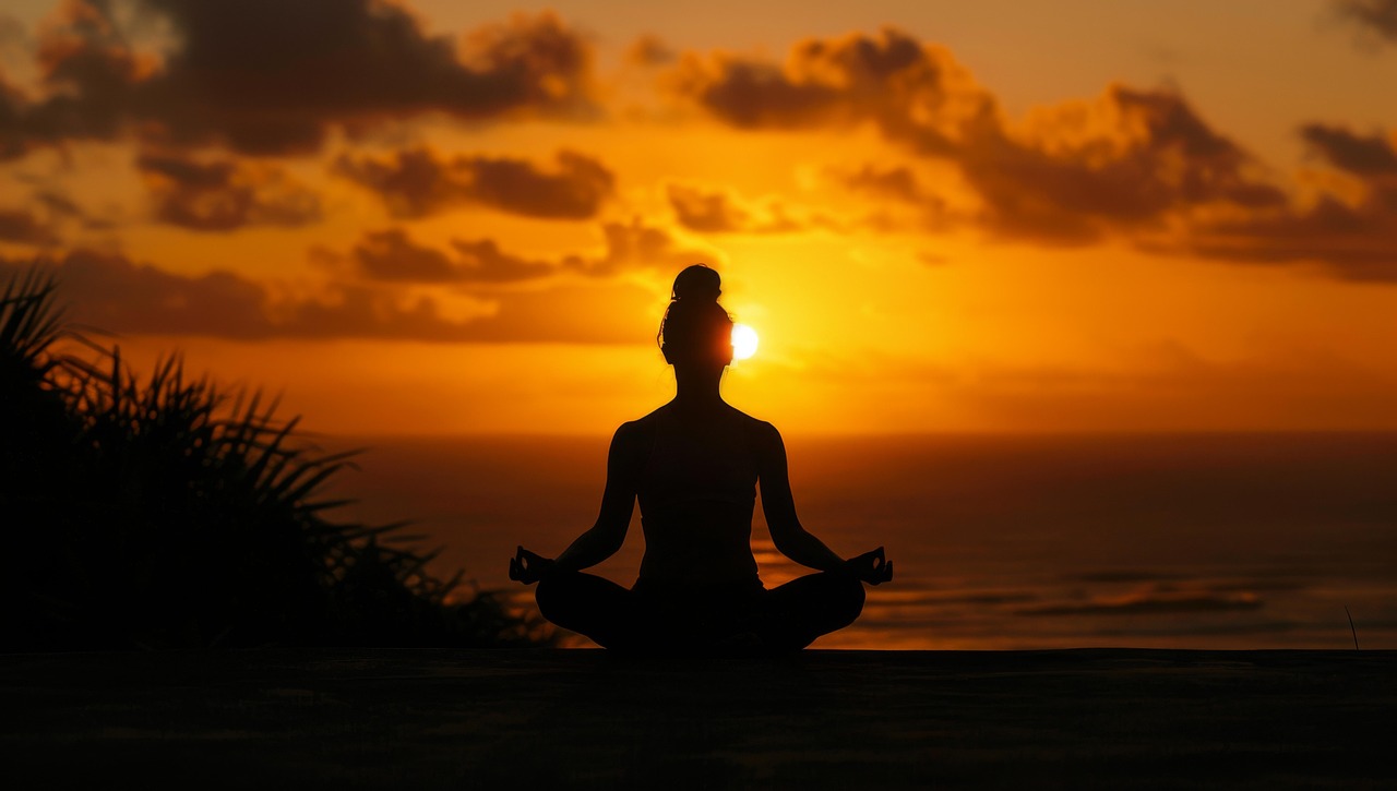 Client practicing breathwork and somatic healing techniques